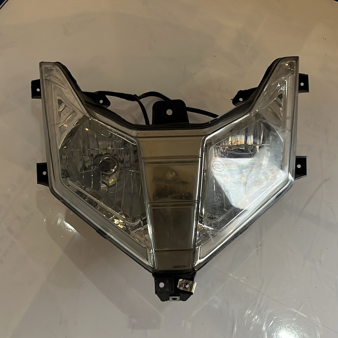 Faro delantero Wottan Storm 125 2021